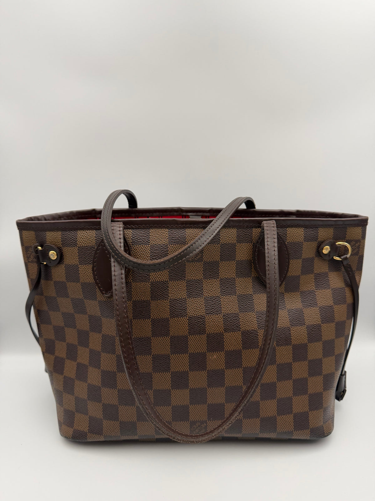 Lois Vuitton Neverfull MM in Damier Ebene Canvas with a Cerise Red Textile int.